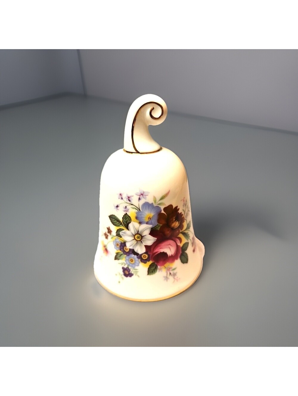 This item is a Royal Albert fine bone china bell, manufactured...